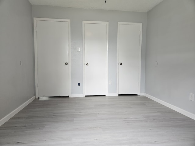 21631 Park Villa Dr, Katy, TX 77450 - unfurnished bedroom with wood finished floors and baseboards