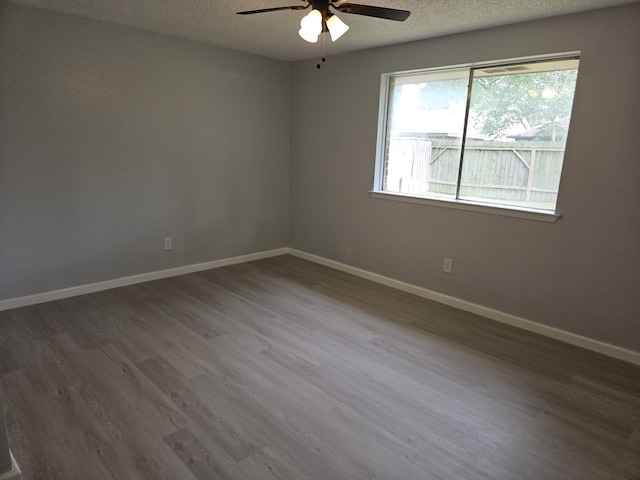 21631 Park Villa Dr, Katy, TX 77450 - unfurnished room featuring wood finished floors, ceiling fan, a textured ceiling, and baseboards