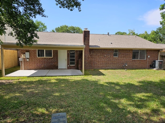 21631 Park Villa Dr, Katy, TX 77450 - back of property with cooling unit, brick siding, a chimney, and a patio