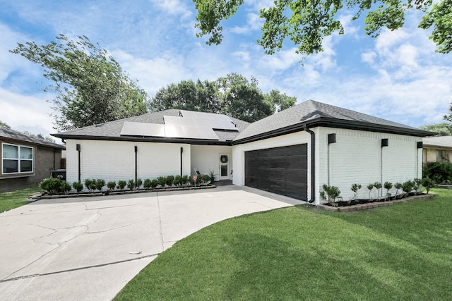 3707 Kingston Vale Dr, Houston, TX 77082 - view of front of property featuring brick siding, a front lawn, an attached garage, driveway, and solar panels