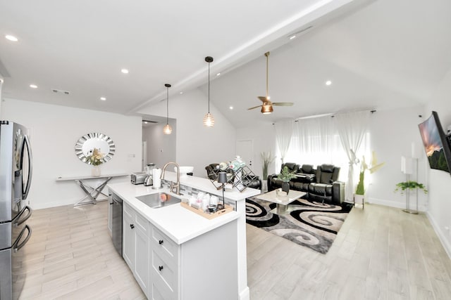 3707 Kingston Vale Dr, Houston, TX 77082 - kitchen with a sink, stainless steel refrigerator with ice dispenser, dishwashing machine, vaulted ceiling, and a ceiling fan