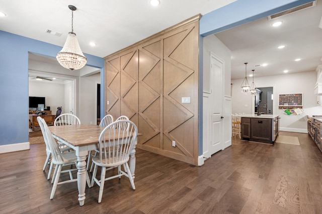 415 Faust Ln, Houston, TX 77024 - dining room with dark wood-style floors, baseboards, a chandelier, and recessed lighting