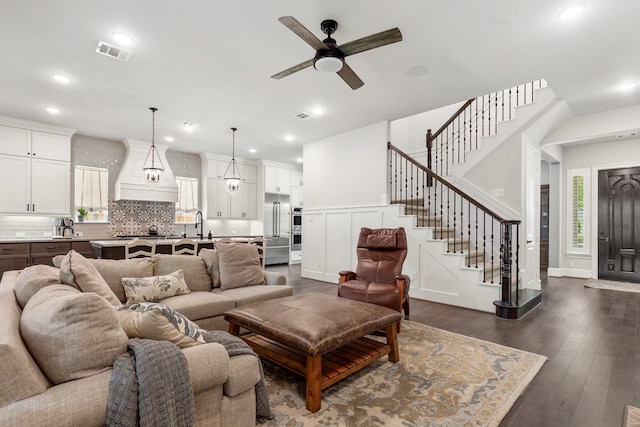 415 Faust Ln, Houston, TX 77024 - living room featuring a ceiling fan, stairway, dark wood-type flooring, and recessed lighting