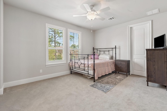 415 Faust Ln, Houston, TX 77024 - bedroom with light carpet, baseboards, and a ceiling fan