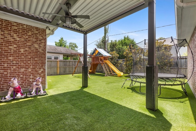 415 Faust Ln, Houston, TX 77024 - view of yard featuring a trampoline, ceiling fan, and a playground
