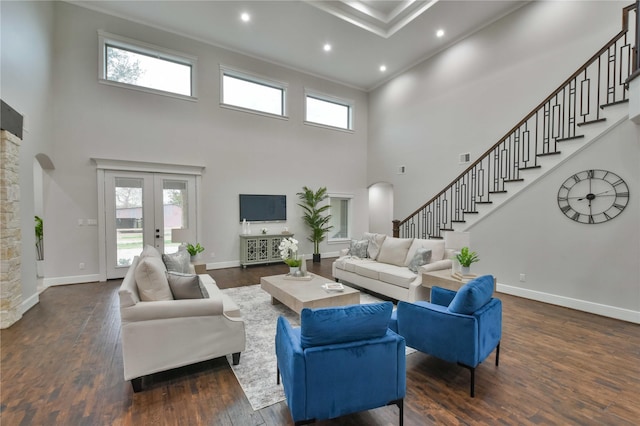 7737 Brookside Rd, Pearland, TX 77581 - living room featuring a high ceiling, stairs, dark wood-type flooring, baseboards, and recessed lighting