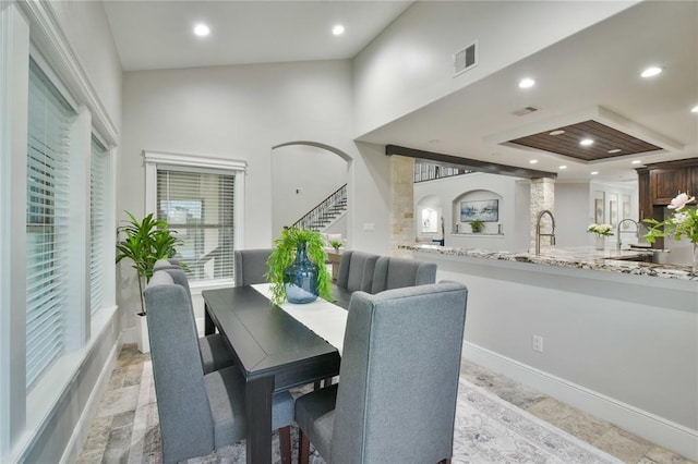7737 Brookside Rd, Pearland, TX 77581 - dining space featuring stairs, recessed lighting, a tray ceiling, and baseboards