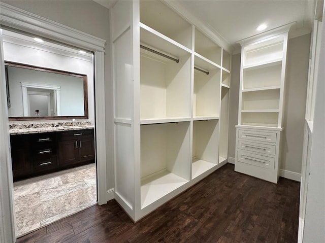 7737 Brookside Rd, Pearland, TX 77581 - walk in closet with dark wood-style flooring