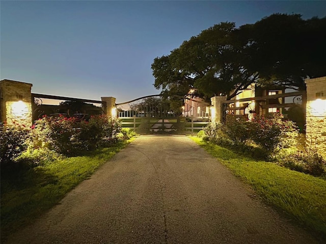 7737 Brookside Rd, Pearland, TX 77581 - view of asphalt driveway with a gate