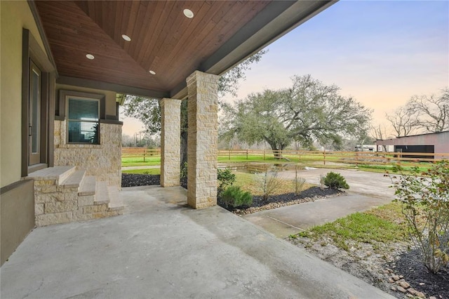7737 Brookside Rd, Pearland, TX 77581 - patio terrace at dusk with a patio area
