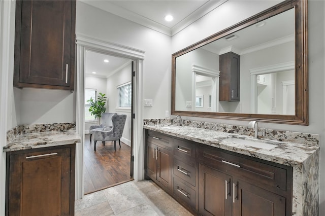 7737 Brookside Rd, Pearland, TX 77581 - bathroom featuring double vanity, crown molding, baseboards, and recessed lighting