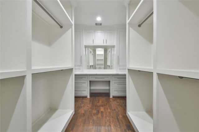 7737 Brookside Rd, Pearland, TX 77581 - walk in closet featuring dark wood-style flooring