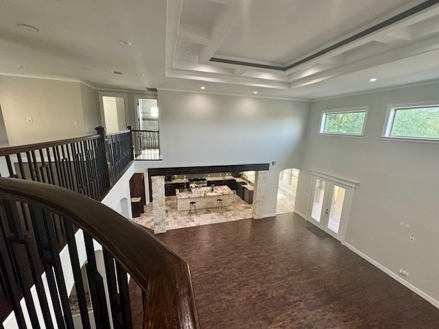 7737 Brookside Rd, Pearland, TX 77581 - hall with crown molding, an upstairs landing, wood finished floors, and baseboards