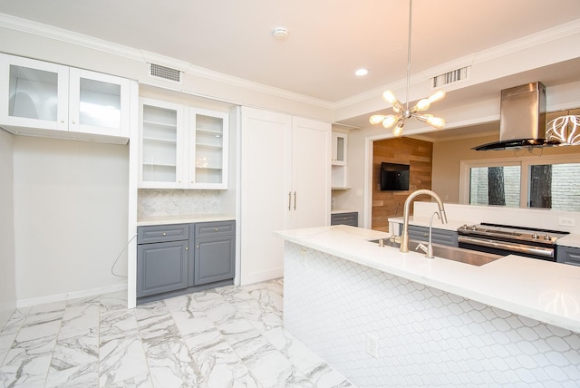 201 Vanderpool Ln Unit 27, Houston, TX 77024 - kitchen featuring island range hood, gray cabinets, stainless steel stove, a sink, and a chandelier
