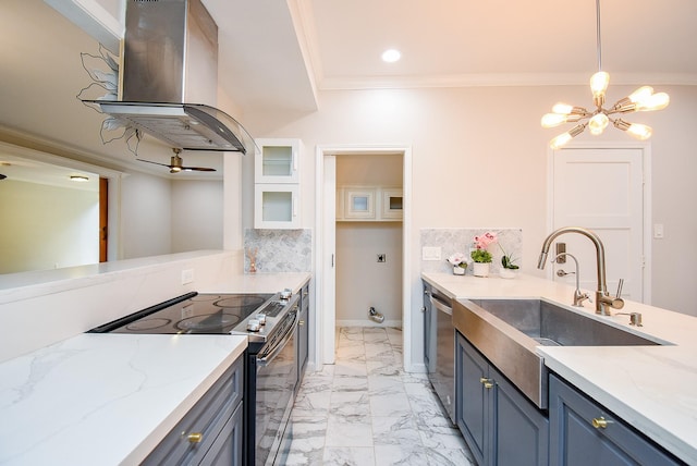 201 Vanderpool Ln Unit 27, Houston, TX 77024 - kitchen with stainless steel appliances, island range hood, a sink, a chandelier, and light marble finish flooring