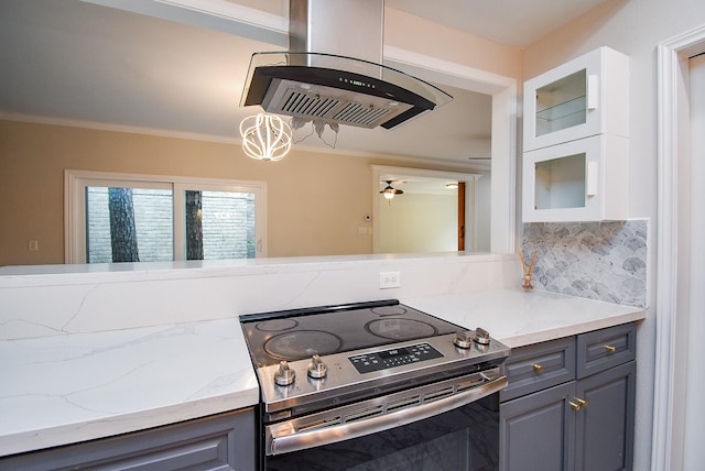 201 Vanderpool Ln Unit 27, Houston, TX 77024 - kitchen with stainless steel range with electric cooktop, glass insert cabinets, light stone countertops, crown molding, and exhaust hood