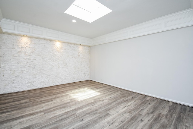 201 Vanderpool Ln Unit 27, Houston, TX 77024 - unfurnished room featuring a skylight, wood finished floors, and recessed lighting