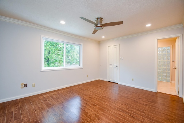 201 Vanderpool Ln Unit 27, Houston, TX 77024 - unfurnished room featuring ceiling fan, wood finished floors, ornamental molding, baseboards, and recessed lighting
