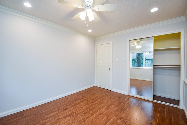 201 Vanderpool Ln Unit 27, Houston, TX 77024 - unfurnished bedroom with wood finished floors, baseboards, ornamental molding, a ceiling fan, and a closet