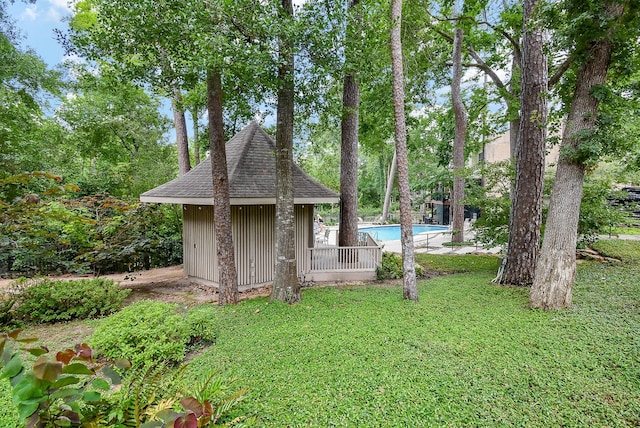 201 Vanderpool Ln Unit 27, Houston, TX 77024 - view of grassy yard with an outdoor pool