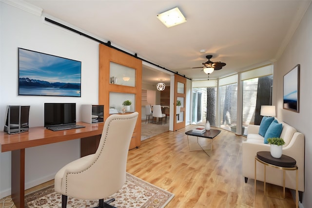 201 Vanderpool Ln Unit 27, Houston, TX 77024 - home office featuring a barn door, ceiling fan, light wood finished floors, crown molding, and a wall of windows