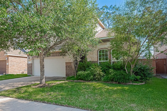 13513 Palo Lake Ln, Houston, TX 77044 - obstructed view of property with brick siding, concrete driveway, and an attached garage