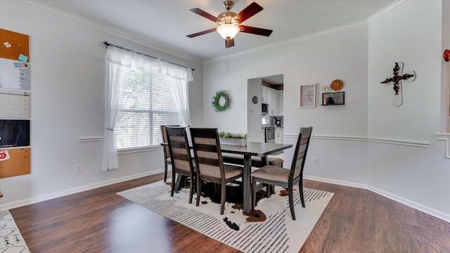 20703 Emerald Spruce Ct, Kingwood, TX 77346 - dining space with dark wood finished floors, crown molding, ceiling fan, and baseboards