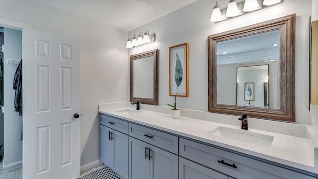 20703 Emerald Spruce Ct, Kingwood, TX 77346 - full bathroom with double vanity and baseboards