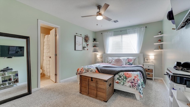 20703 Emerald Spruce Ct, Kingwood, TX 77346 - bedroom with light colored carpet, ensuite bath, ceiling fan, and baseboards
