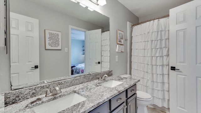 20703 Emerald Spruce Ct, Kingwood, TX 77346 - full bath with toilet, double vanity, and connected bathroom