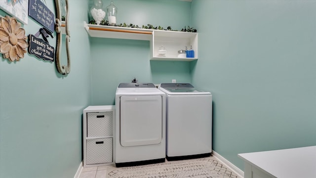 20703 Emerald Spruce Ct, Kingwood, TX 77346 - washroom featuring washing machine and dryer, baseboards, and light tile patterned flooring