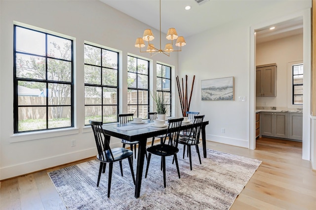 1810 Woodcrest Dr, Houston, TX 77018 - dining room featuring baseboards, light wood-style flooring, a chandelier, and recessed lighting