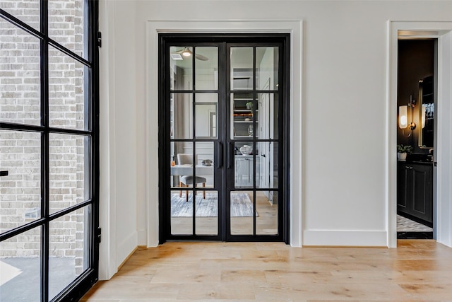 1810 Woodcrest Dr, Houston, TX 77018 - doorway to outside featuring wood finished floors and baseboards