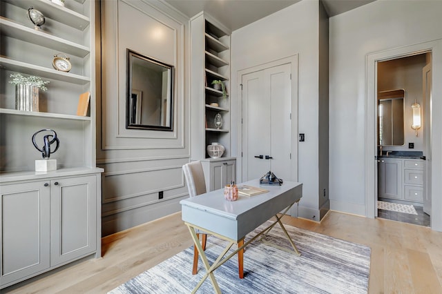 1810 Woodcrest Dr, Houston, TX 77018 - office area with light wood-type flooring and baseboards