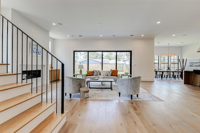1810 Woodcrest Dr, Houston, TX 77018 - living area featuring light wood-style flooring, recessed lighting, and stairway