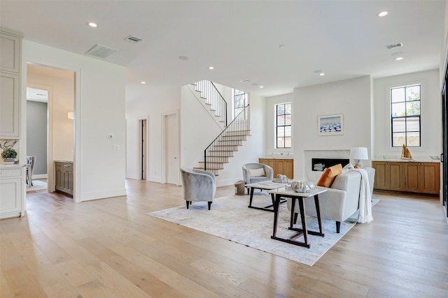 1810 Woodcrest Dr, Houston, TX 77018 - living area featuring plenty of natural light, a fireplace, light wood-style flooring, and recessed lighting
