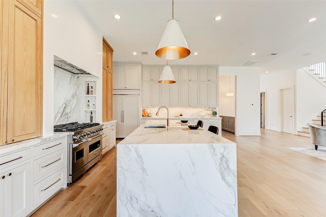 1810 Woodcrest Dr, Houston, TX 77018 - kitchen with premium appliances, a sink, decorative backsplash, a center island with sink, and recessed lighting