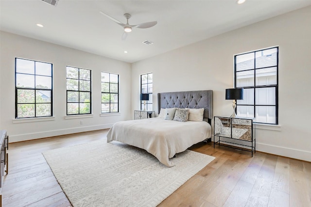 1810 Woodcrest Dr, Houston, TX 77018 - bedroom featuring baseboards, wood finished floors, recessed lighting, and ceiling fan