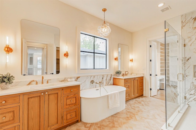 1810 Woodcrest Dr, Houston, TX 77018 - full bath with a marble finish shower, two vanities, a freestanding bath, and a chandelier