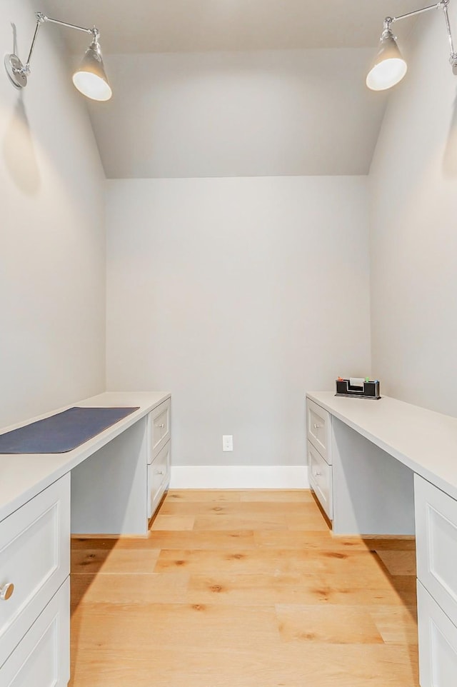 1810 Woodcrest Dr, Houston, TX 77018 - unfurnished office with lofted ceiling, light wood-style floors, built in study area, and baseboards