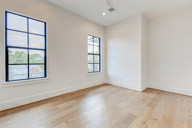 1810 Woodcrest Dr, Houston, TX 77018 - empty room with plenty of natural light, light wood-style flooring, baseboards, and recessed lighting