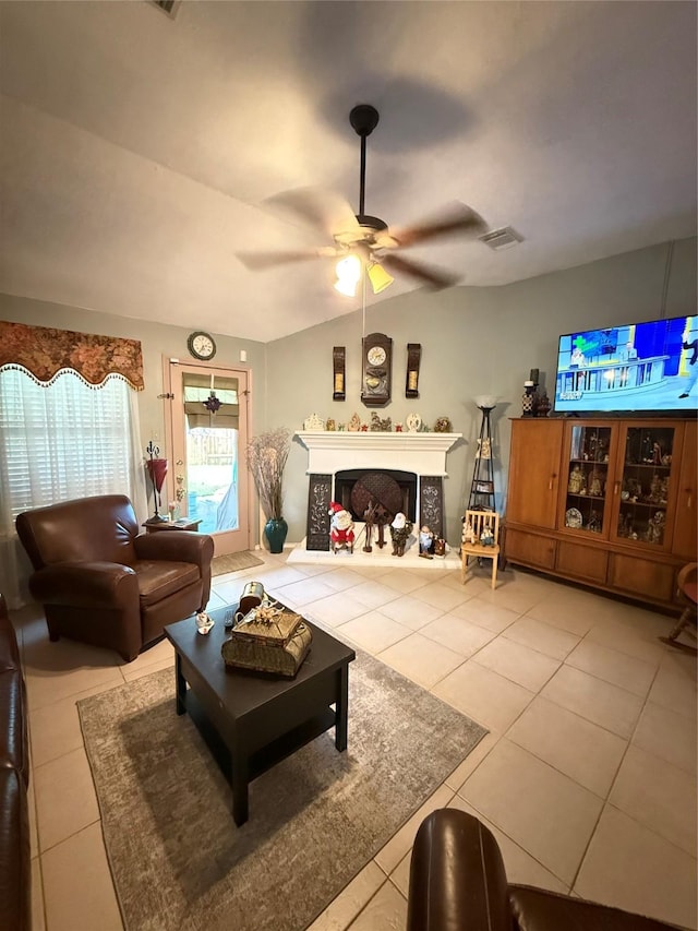 20122 Yellow Canyon Falls Dr, Tomball, TX 77375 - living room featuring tile patterned floors, a ceiling fan, vaulted ceiling, and a fireplace with raised hearth