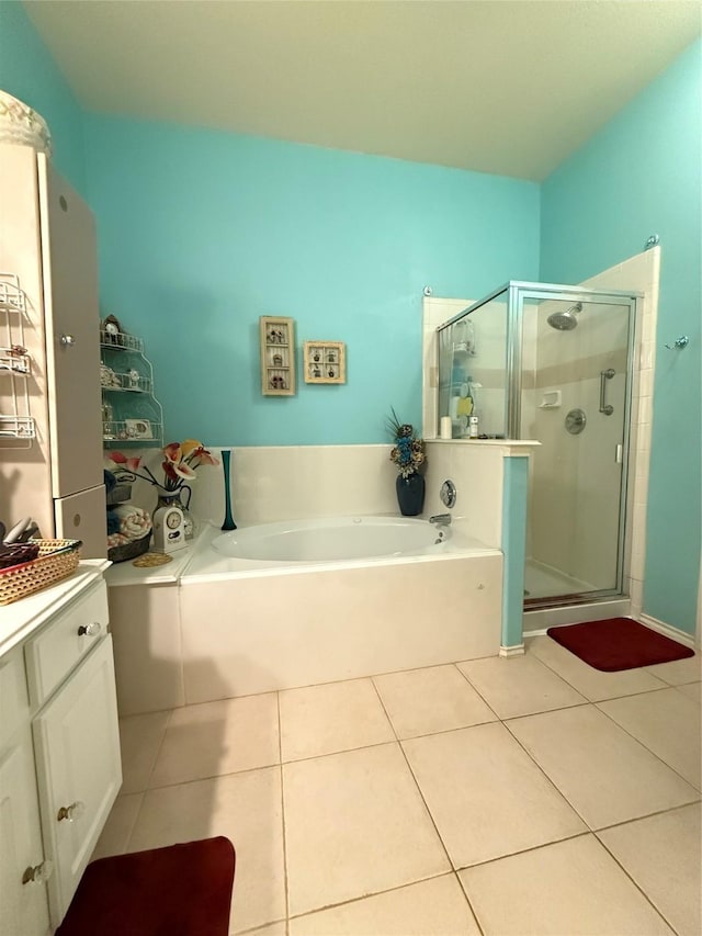 20122 Yellow Canyon Falls Dr, Tomball, TX 77375 - full bathroom featuring a bath, a stall shower, tile patterned floors, and vanity