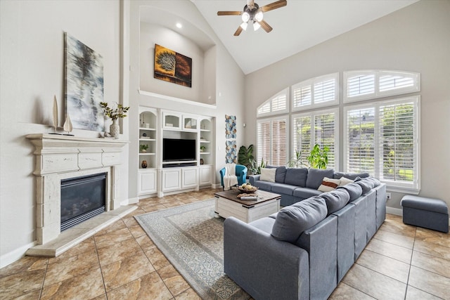 15718 Starcreek Ln, Houston, TX 77044 - living area featuring high vaulted ceiling, ceiling fan, a fireplace, baseboards, and built in features