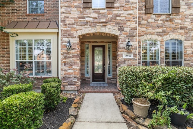15718 Starcreek Ln, Houston, TX 77044 - entrance to property with stone siding and a standing seam roof