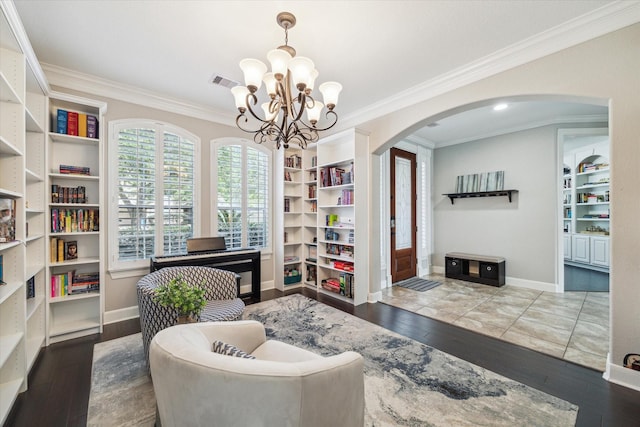 15718 Starcreek Ln, Houston, TX 77044 - office featuring arched walkways, ornamental molding, a chandelier, wood finished floors, and baseboards