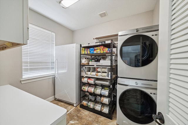 15718 Starcreek Ln, Houston, TX 77044 - washroom featuring stacked washer / drying machine