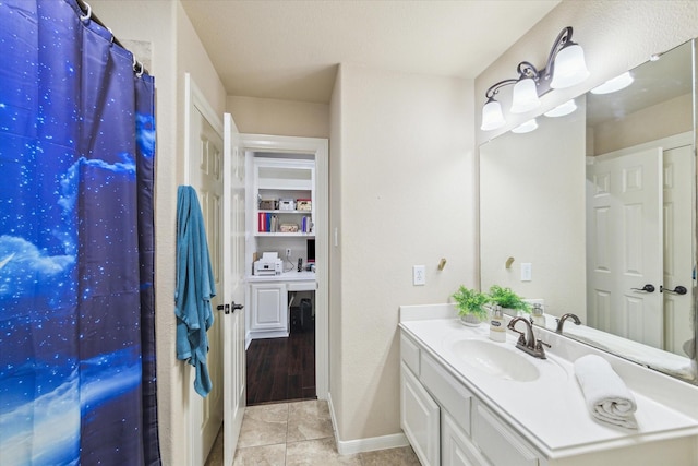 15718 Starcreek Ln, Houston, TX 77044 - bathroom with vanity, tile patterned flooring, and baseboards
