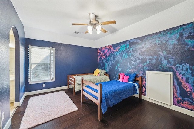 15718 Starcreek Ln, Houston, TX 77044 - bedroom featuring wood finished floors, a ceiling fan, and baseboards
