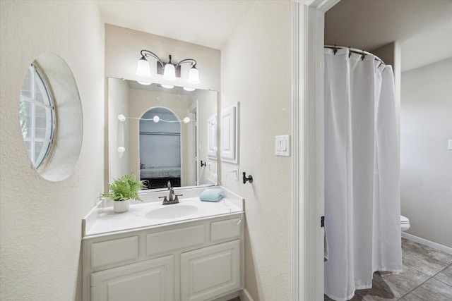 15718 Starcreek Ln, Houston, TX 77044 - bathroom with vanity, toilet, and baseboards